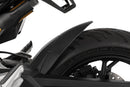 The area around the swing arm pivot, the swing arm, the collector, the gears and the shock absorber are in front of the rear wheel and thus