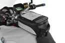 The mounting system is attached to the vehicle with minimal hand pressure and the tank bag can be quickly fastened to it. 