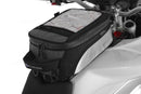 The mounting system is attached to the vehicle with minimal hand pressure and the tank bag can be quickly fastened to it. 