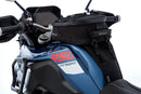 The mounting system is attached to the vehicle with minimal hand pressure and the tank bag can be quickly fastened to it. 