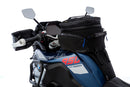 The mounting system is attached to the vehicle with minimal hand pressure and the tank bag can be quickly fastened to it. 