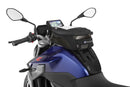The mounting system is attached to the vehicle with minimal hand pressure and the tank bag can be quickly fastened to it. 