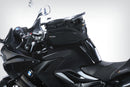 The mounting system is attached to the vehicle with minimal hand pressure and the tank bag can be quickly fastened to it. 