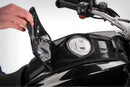 The mounting system is attached to the vehicle with minimal hand pressure and the tank bag can be quickly fastened to it. 