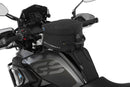 The mounting system is attached to the vehicle with minimal hand pressure and the tank bag can be quickly fastened to it. 