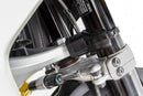 Limit and dampen the steering angle in the event of a fall, even before the standard steering stops are reached with full force