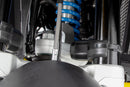 Limit and dampen the steering angle in the event of a fall, even before the standard steering stops are reached with full force