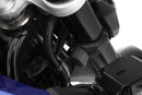 Limit and dampen the steering angle in the event of a fall, even before the standard steering stops are reached with full force