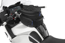 The mounting system is attached to the vehicle with minimal hand pressure and the tank bag can be quickly fastened to it. 