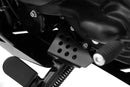 Solid all-round protection for the exposed ignition interruption switch on the side stand.