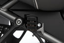 Discreetly integrated protective cover for the rear wheel brake fluid reservoir