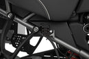 Discreetly integrated protective cover for the rear wheel brake fluid reservoir